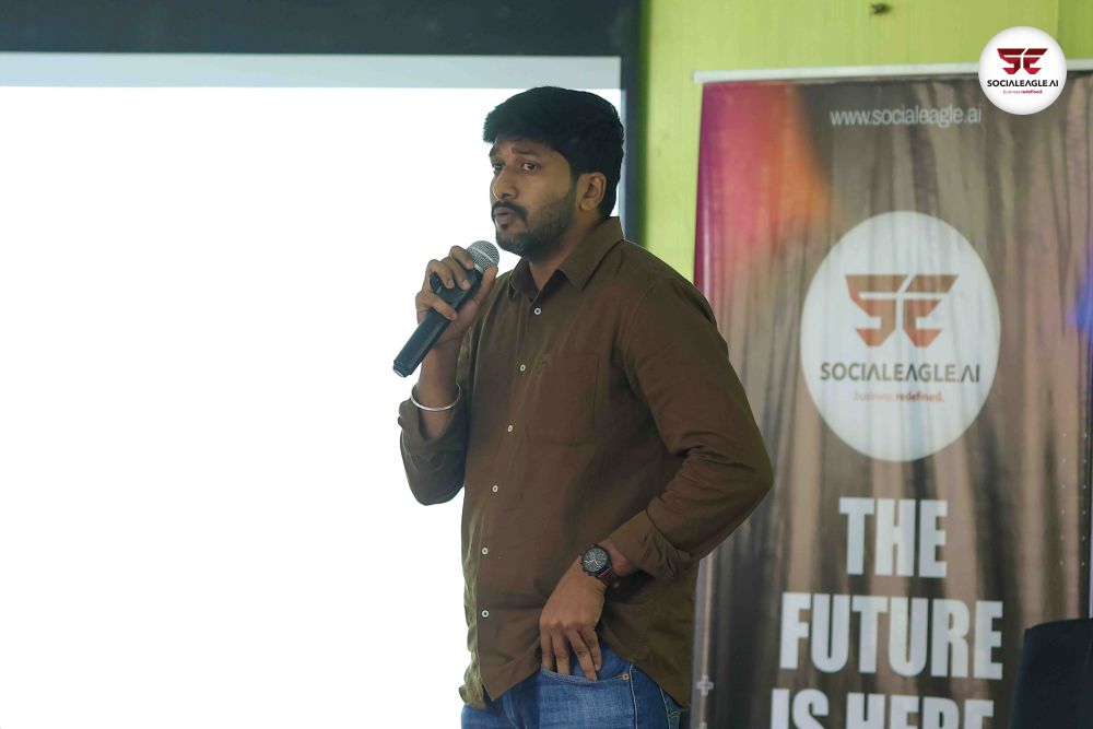Man in green long-sleeve shirt speaking at podium with microphone