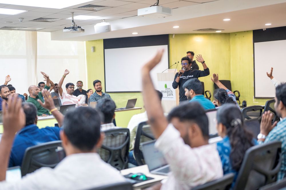 Man in traditional attire speaking at podium